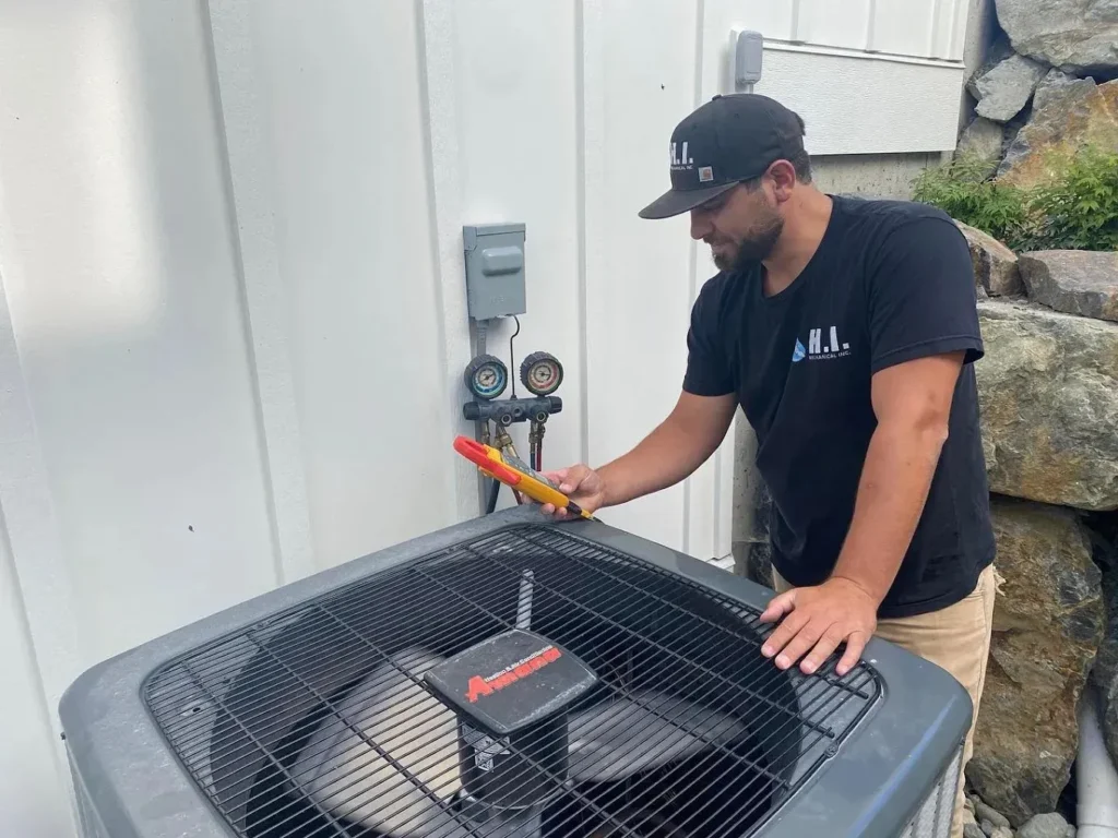 HVAC technician assessing a commercial HVAC unit for repairs